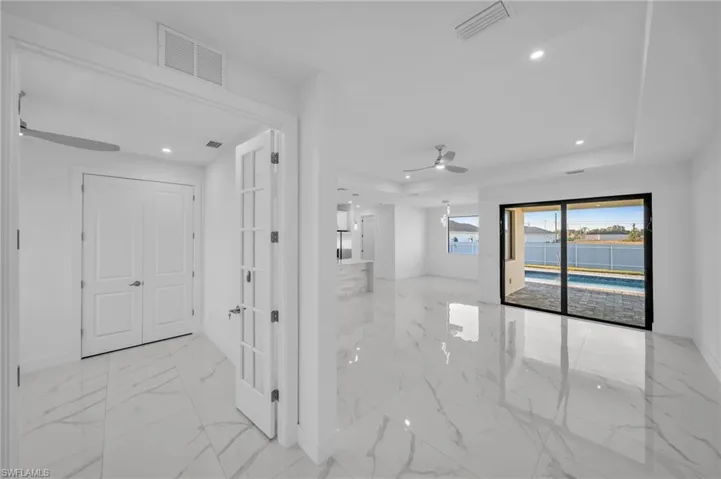 Hall featuring recessed lighting, visible vents, baseboards, and marble finish floor
