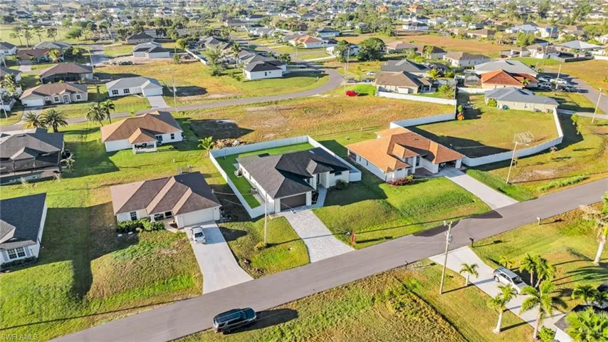 Birds eye view of property with a residential view