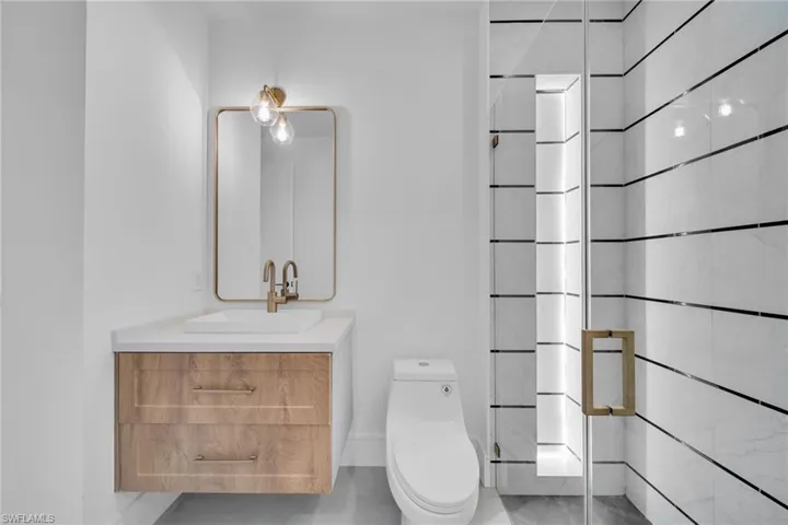 Bathroom with vanity and a stall shower