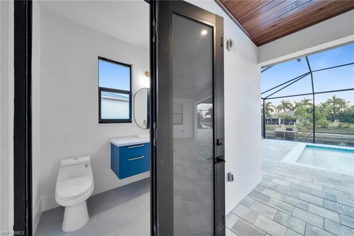 Half bath featuring vanity and wood ceiling