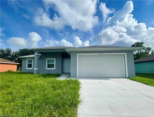 Ranch-style house featuring a garage