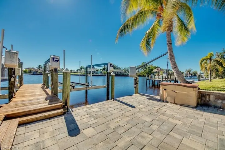 Dock area featuring a water view