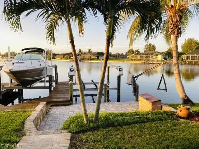 Dock area featuring a water view