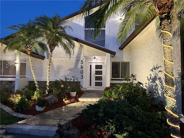 Property entrance with stucco siding