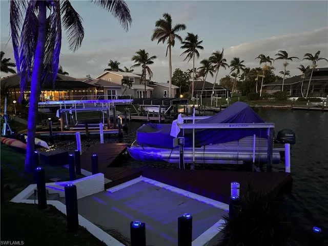 Dock with a water view and boat lift