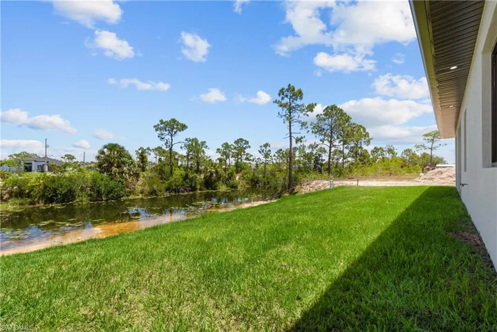 View of grassy yard featuring a water view