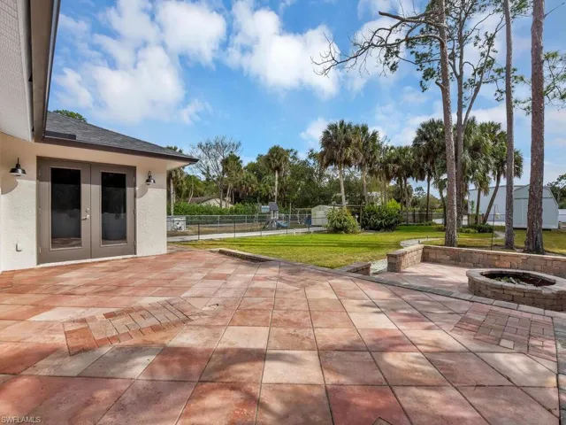 View of patio / terrace with an outdoor fire pit and french doors