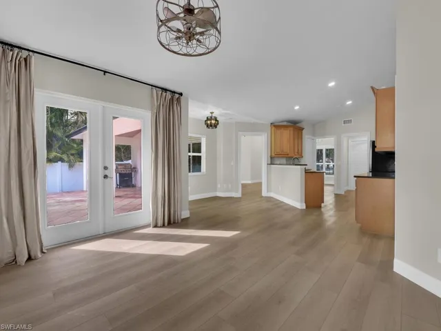 Lots of Light and space, new flooring, fresh paint leading from living room to kitchen and front formal living area.