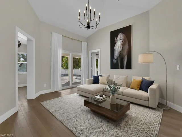 Living area featuring hardwood / wood-style flooring and a chandelier *AI Generated furnishings*