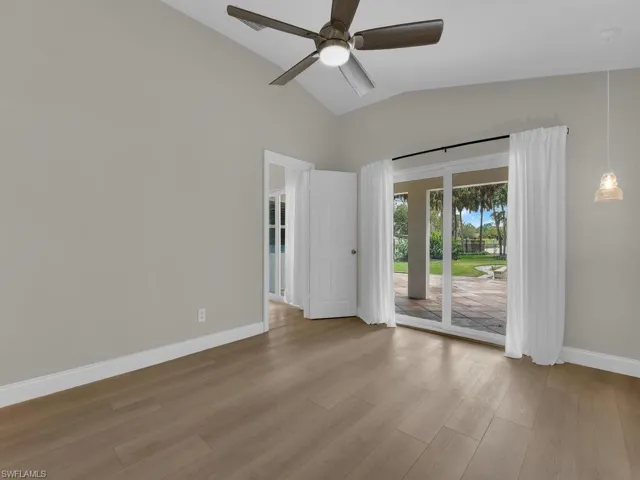 Unfurnished master bedroom with lofted ceiling, light wood-type flooring, and ceiling fan