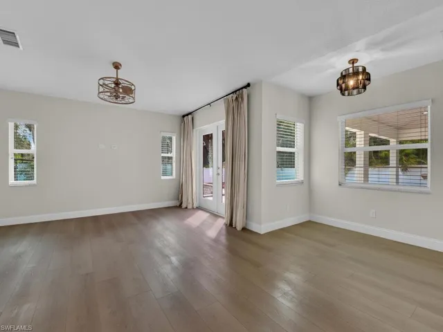 Living room with breakfast/study nook area over looking spacious yard