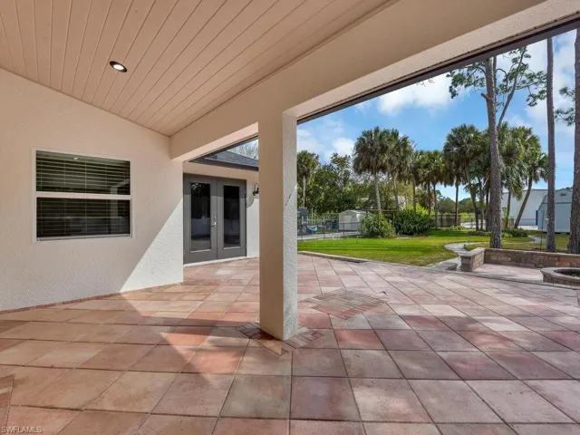 View of covered lanai/ patio featuring french doors