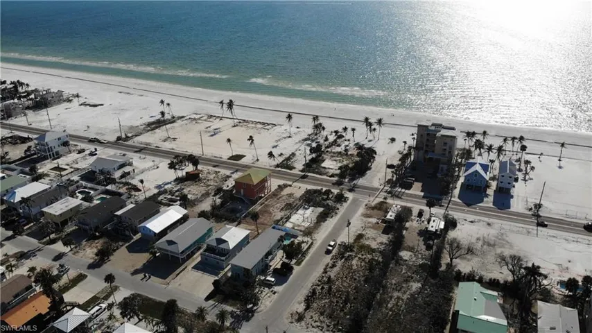 Bird's eye view featuring a view of the beach and a water view