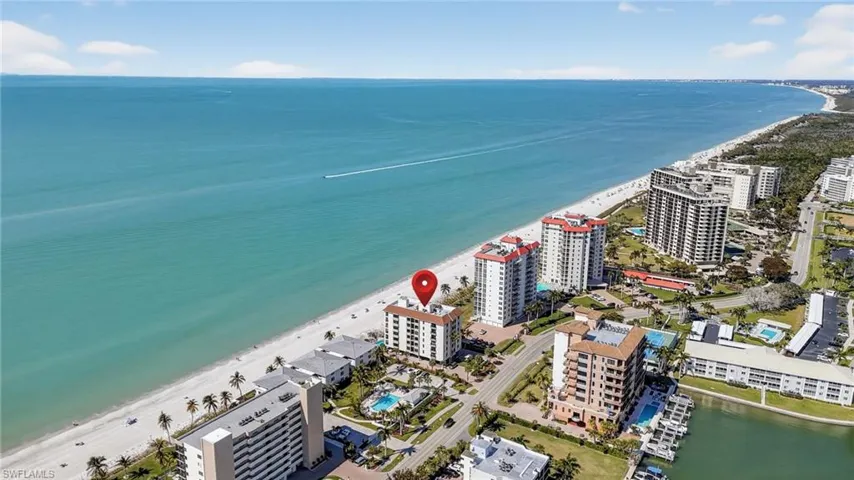View of urban area with extended coastline and apartment complex