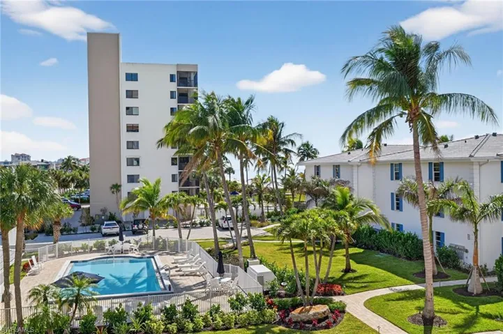 Community pool with a patio