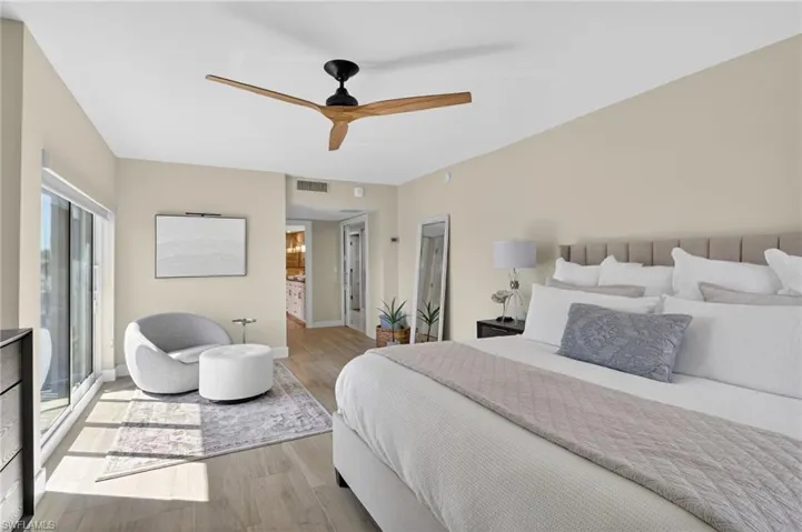Bedroom featuring wood finished floors and ceiling fan