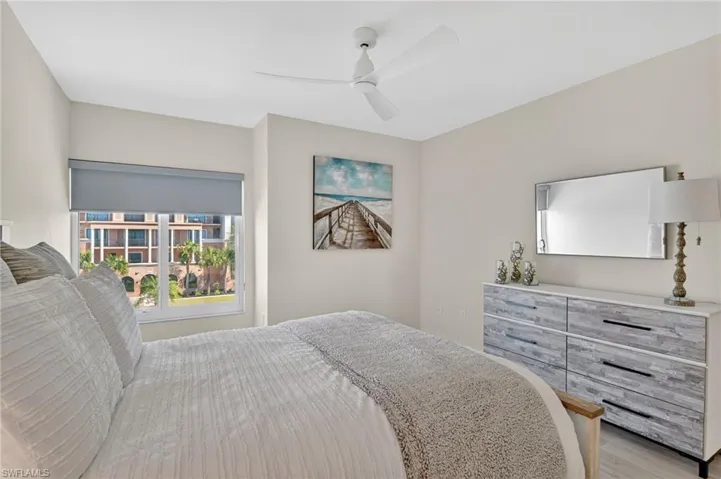 Bedroom with ceiling fan and light wood finished floors