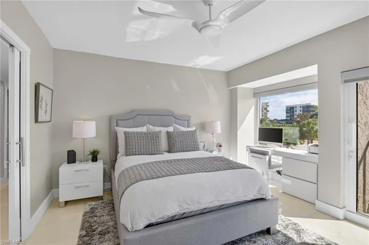 Bedroom featuring ceiling fan and an office area