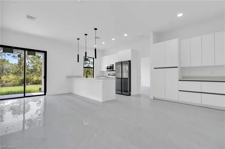 Unfurnished living room with recessed lighting
