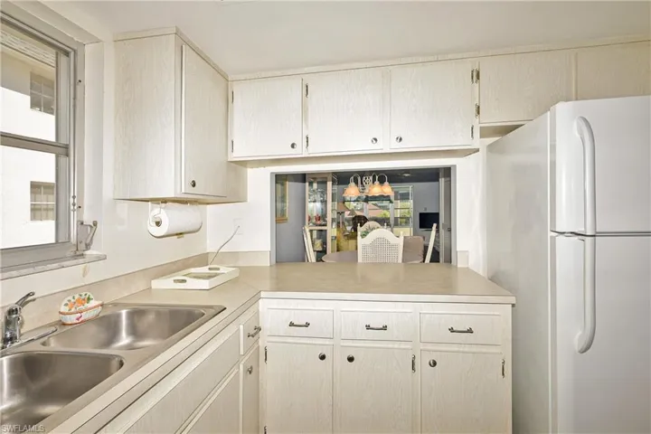 Pass-thru window from the kitchen to the dining area.