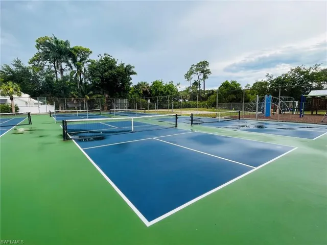 View of pickleball/tennis court featuring community basketball court