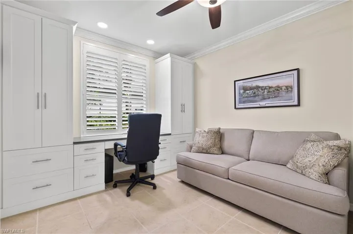 Tiled office featuring ceiling fan and crown molding