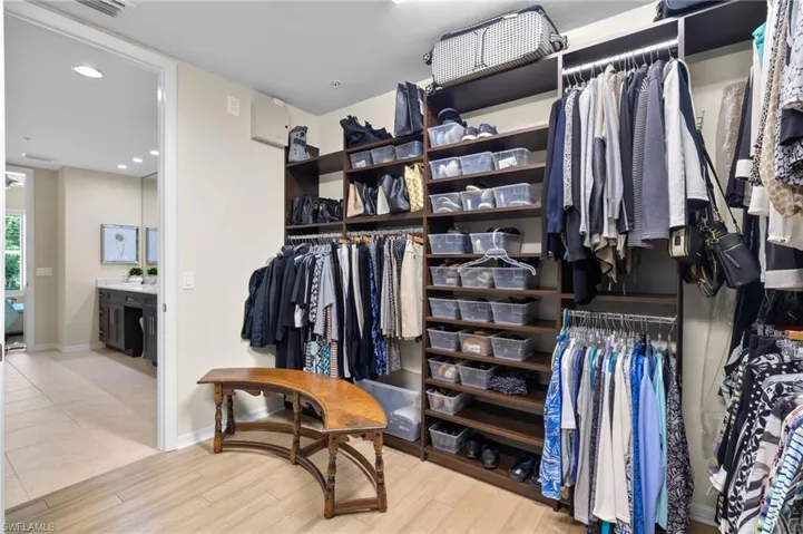 Spacious closet featuring light tile patterned floors