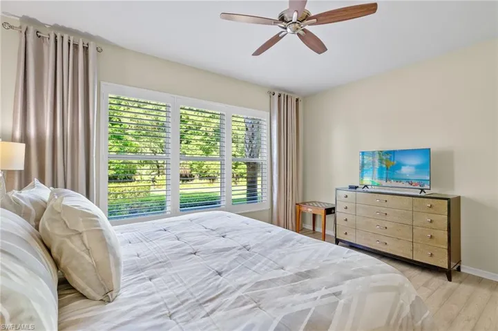 Bedroom featuring light hardwood / wood-style flooring and ceiling fan