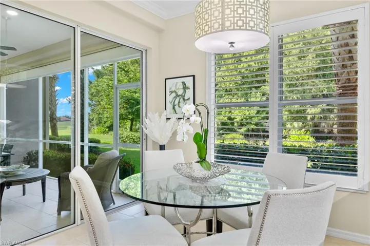 Tiled dining room with crown molding