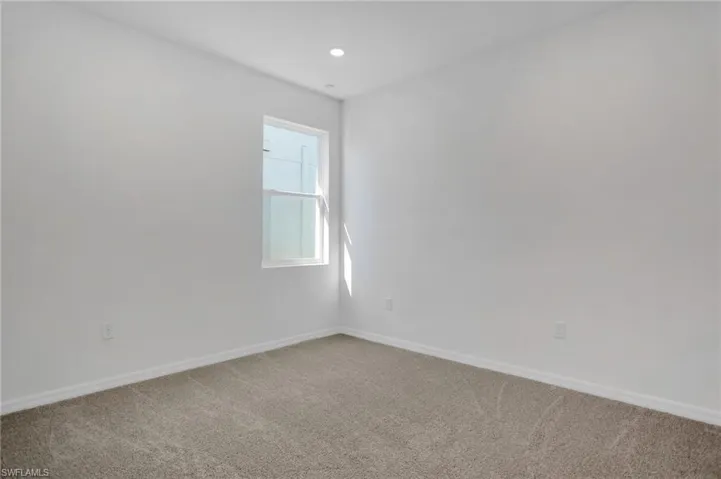 Unfurnished room with carpet floors and recessed lighting