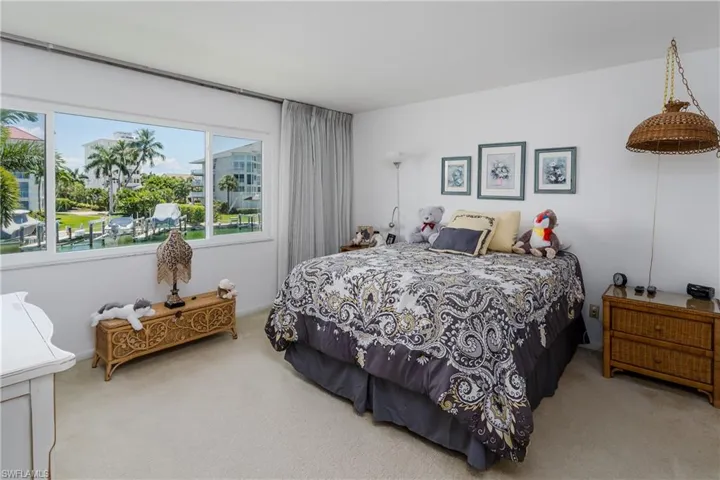 Main bedroom with large picture window and walk-in closet