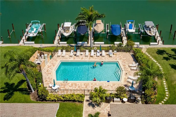 Aerial view of pool.  Lots of chairs for sunbathers!