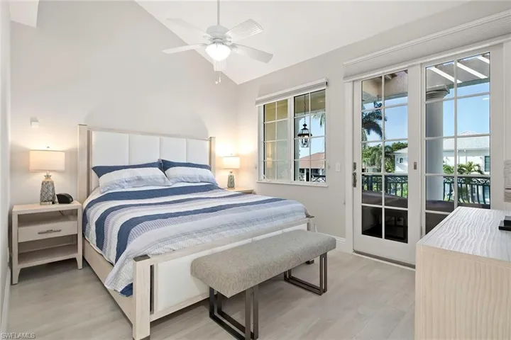 Primary Bedroom with balcony overlooking the water.