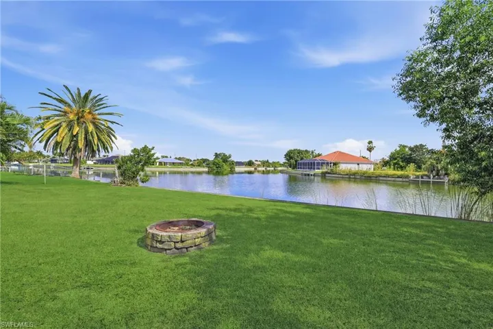 Water view with a fire pit