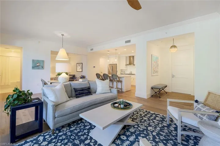 Spacious great room with adjoining den & kitchen.
