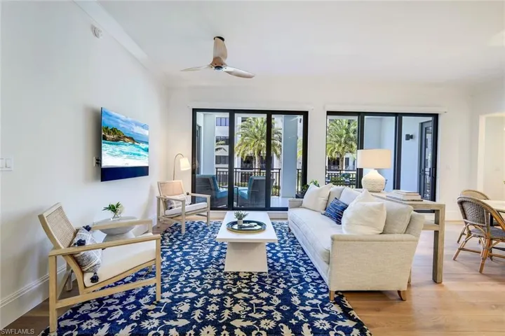 Living room featuring Legno Bastone wood floors and lovely views