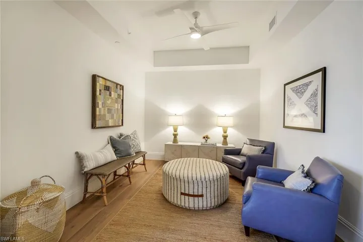 Large sitting room/den with wood floors