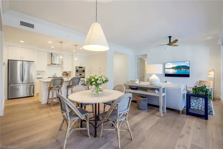 Great room featuring wood floors & designer lighting