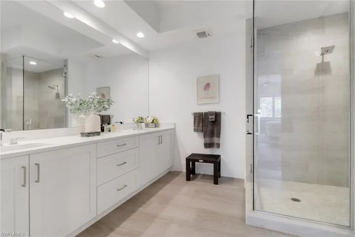 Large primary bath with a glass shower & double sinks