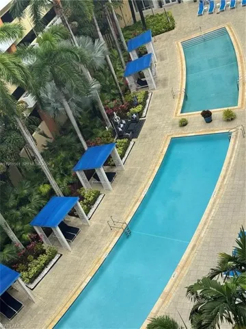 Outdoor swimming pool area featuring two distinct pool designs
