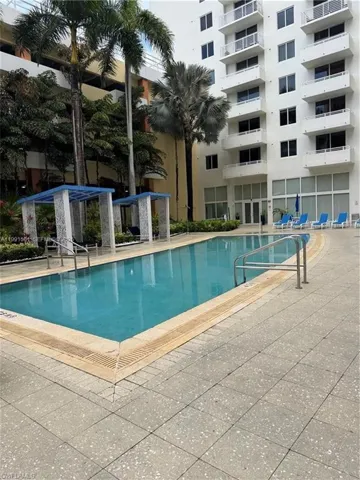 Outdoor swimming pool with integrated entry steps and perimeter drainage