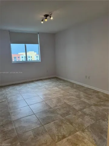 Neutral-toned tile flooring throughout