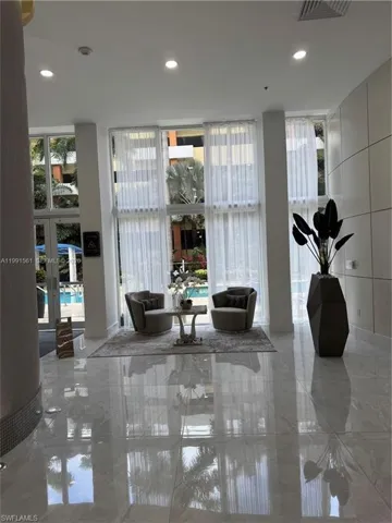 Polished tile flooring extending throughout a spacious interior