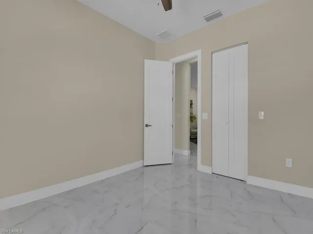 Unfurnished room featuring ceiling fan