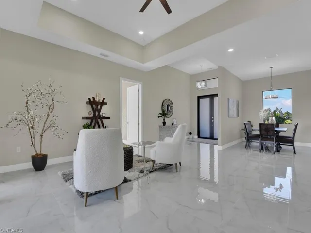 Living room with french doors and ceiling fan