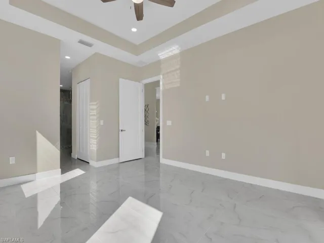 Spare room with ceiling fan