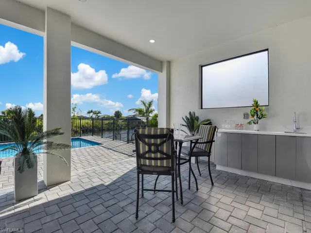 View of patio / terrace with a fenced in pool