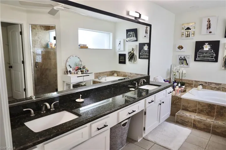Primary Bath w/soaker tub, separate walk-in shower, and private commode.