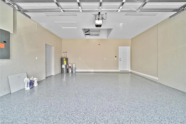 Professionally finished epoxy coated garage floor with clear coat