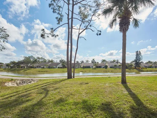 Expansive backyard with lush greenery and scenic surroundings.